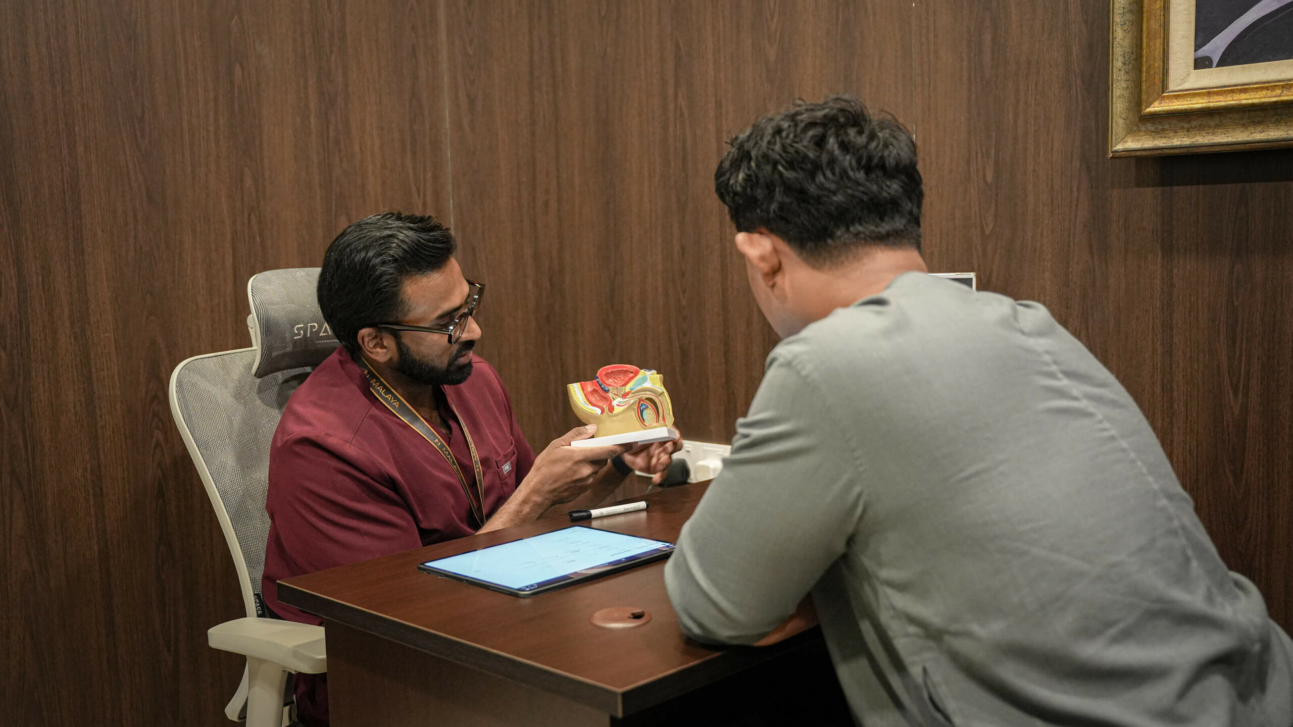 A private men’s health consultation at Malaya